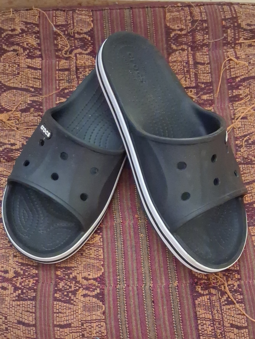 CROCS Black Slide Sandals with White Trim